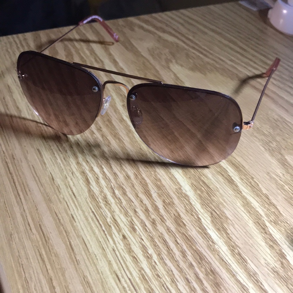 Brown and light pink oval sunglasses